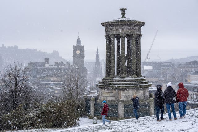 People in the snow on Calton Hill
