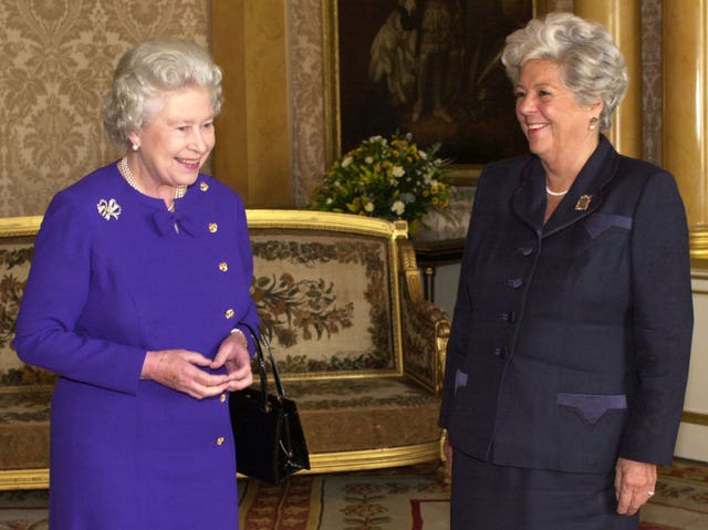 Queen Elizabeth sharing a joke at a farewell audience with Betty Boothroyd at Buckingham Palace