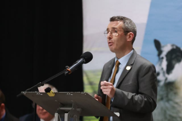 Andrew Muir speaking from a lectern