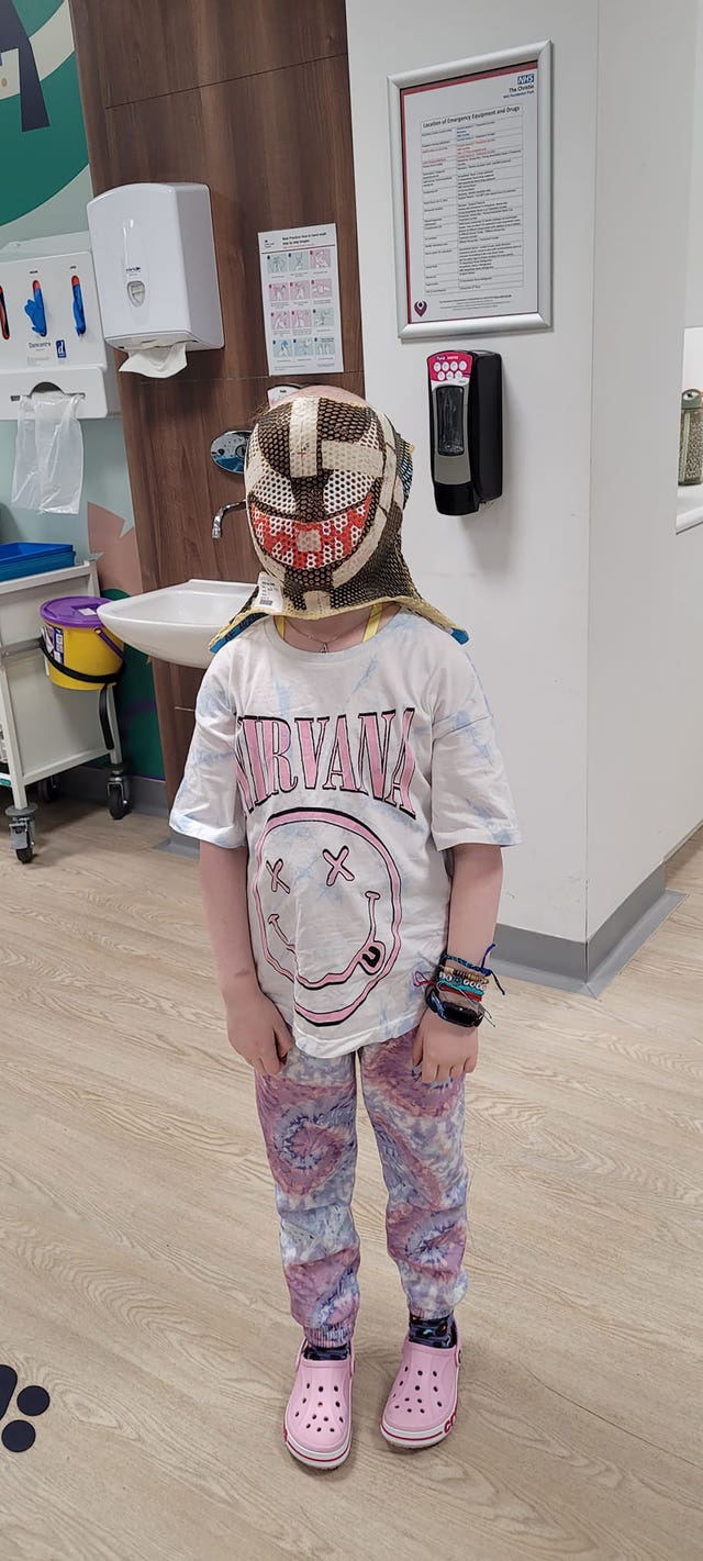 Aurora wearing a radiotherapy mask she painted like the Marvel character Venom (Family handout/PA)