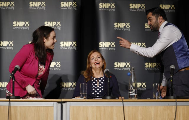 Kate Forbes, Ash Regan and Humza Yousaf joking together after a hustings