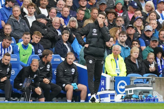 Brighton boss Fabian Hurzeler covers his mouth on the touchline