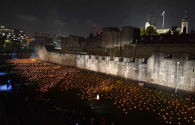 The first of thousands of flames in the dry moat of the Tower of London