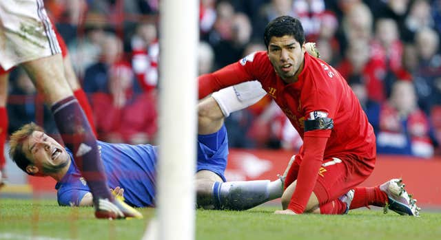 Suarez (right) and Chelsea's Branislav Ivanovic (left) on the ground after Suarez bit Ivanovic on the arm 