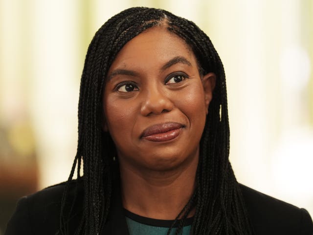 Kemi Badenoch smiles at the camera during a visit to the Isle of Wight
