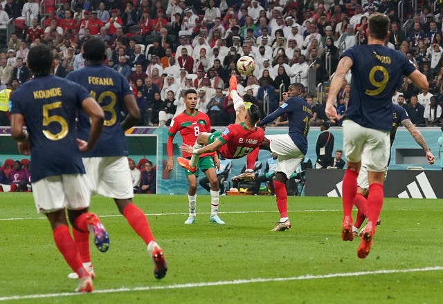 Jawad El Yamiq (centre) attempts an overhead kick