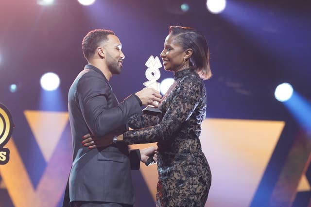 Callum Wilson presenting Denise Lewis with a Mobo award