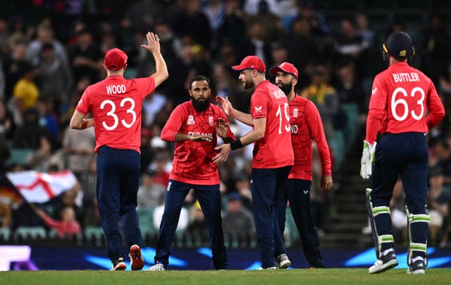 Adil Rashid, centre,  took his first tournament wicket (Dan Himbrechts/PA)