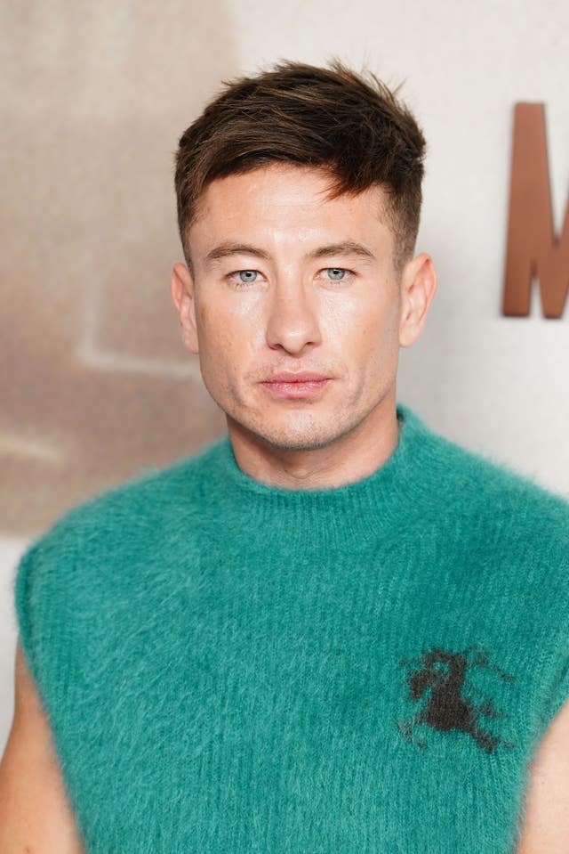Barry Keoghan posing for a photo at a red carpet event