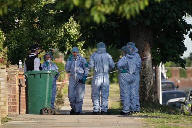 Forensic officers at the scene (Aaron Chown/PA)