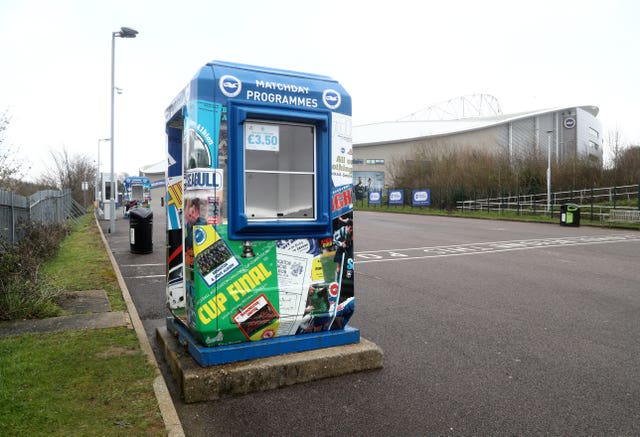 Empty programme stand outside the AMEX Stadium