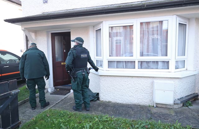 Police search a property in south Belfast in connection with the bombings 