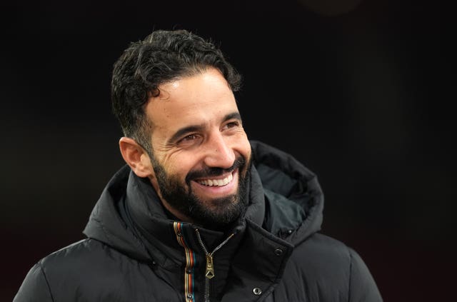 Manchester United manager Ruben Amorim smiles