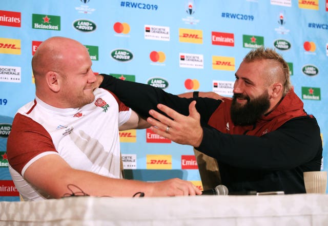 Joe Marler goes to embrace Dan Cole at a press conference