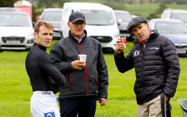 Tom Scudamore (left) with father Peter Scudamore (right) and Donald McCain