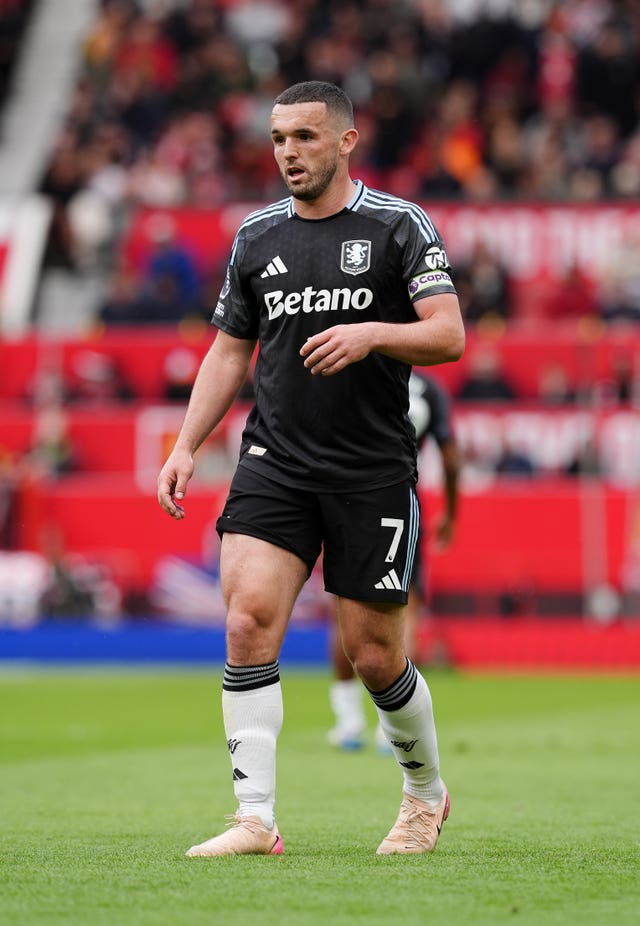 Aston Villa captain John McGinn leaves the pitch after defeat to Manchester United