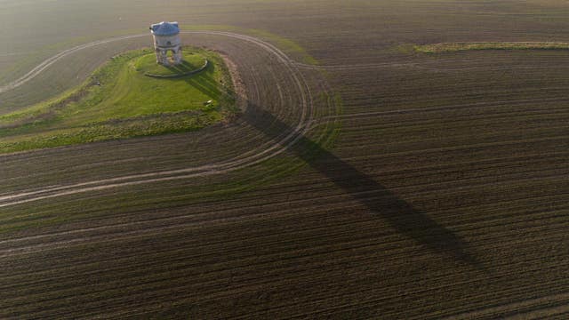 The sun rises behind Chesterton windmill in Warwickshire