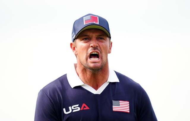 Bryson DeChambeau celebrates holing a putt