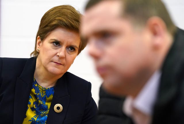Nicola Sturgeon, with Douglas Ross in the foreground