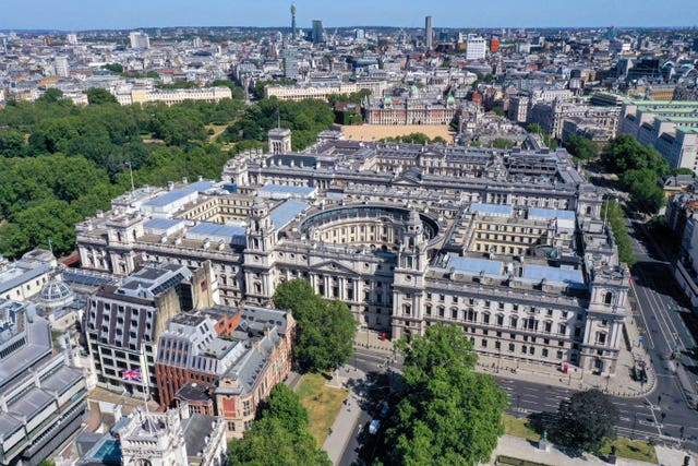 An aerial view of London the junction of Parliament Street and Great George Street, with St James’s Park on the left with government buildings which house departments including: The Treasury, the Department for Digital, Culture, Media and Sport, HMRC, the Foreign and Commonwealth Office, Downing Street, the Cabinet Office and Horseguards Parade, and (right) the Ministry of Defence, the Old War Office Building and the Department for International Trade 