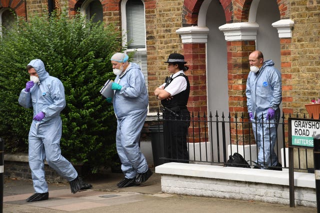 Forensics and police officers at Simonne Kerr's home