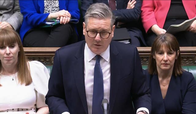 Sir Keir Starmer at the despatch box at PMQs with Angela Rayner sitting to his right and Rachel Reeves sitting to his left