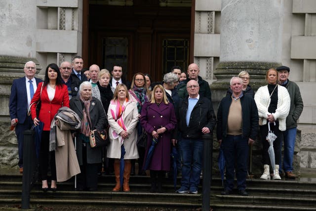 A group of people on the steps of Belfast High Court