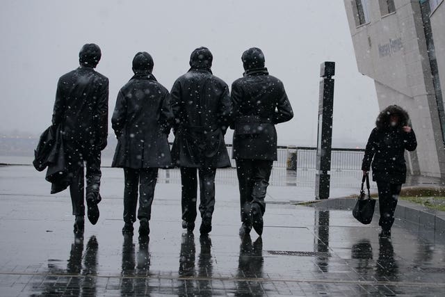 Snow was falling at the Beatles statue in Liverpool 