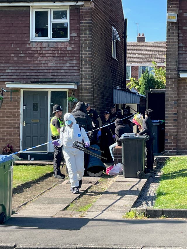 Police officers at the scene in Lovett Avenue, Oldbury. 