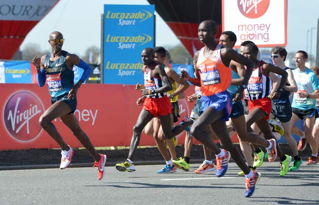 Great Britain’s Olympic 5000 and 10,000 metre champion Mo Farah (left) in the 2013 London Marathon 