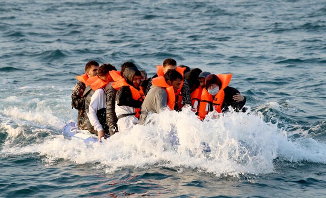 A group of people thought to be migrants crossing the Channel in a small boat headed in the direction of Dover, Kent 