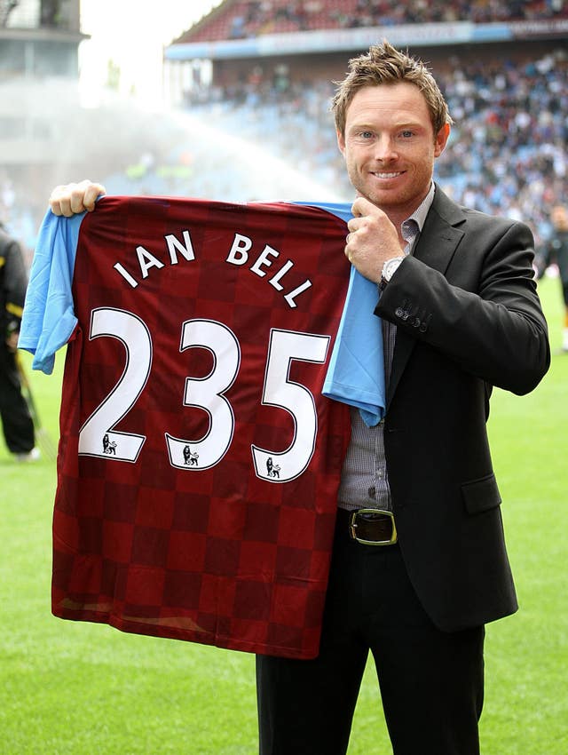 Ian Bell, an Aston Villa fan, holds up a club shirt signifying his 235 runs against India