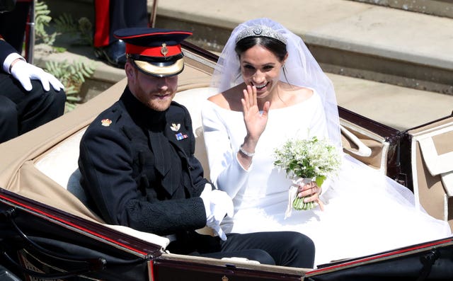 The couple leave St George’s Chapel for their carriage procession (Andrew Matthews/PA)