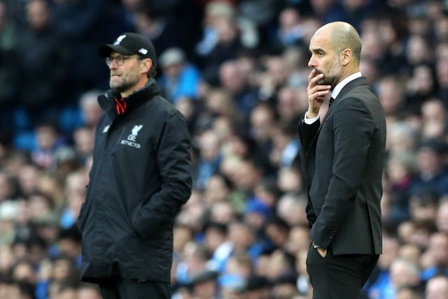 Jurgen Klopp (left) and Pep Guardiola will go head-to-head on January 3