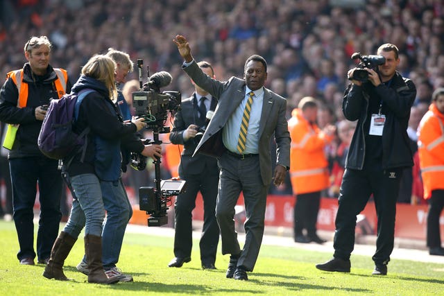 Pele receives a warm welcome after being introduced to fans at Anfield. The Brazilian waved to supporters during half-time of Liverpool's 2-1 loss to rivals Manchester United in March 2015