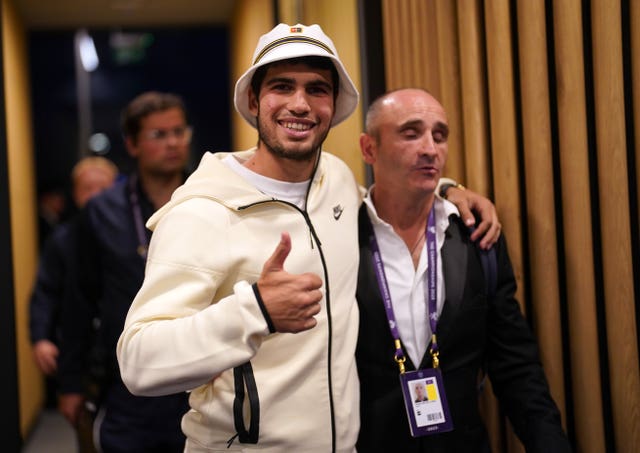 Carlos Alcaraz in his lucky bucket hat after winning Wimbledon 