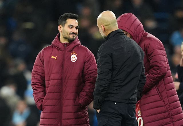 Manchester City manager Pep Guardiola with former Manchester City players Ilkay Gundogan, left, and Leroy Sane 