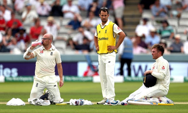 Leach and Roy enjoy a drinks break