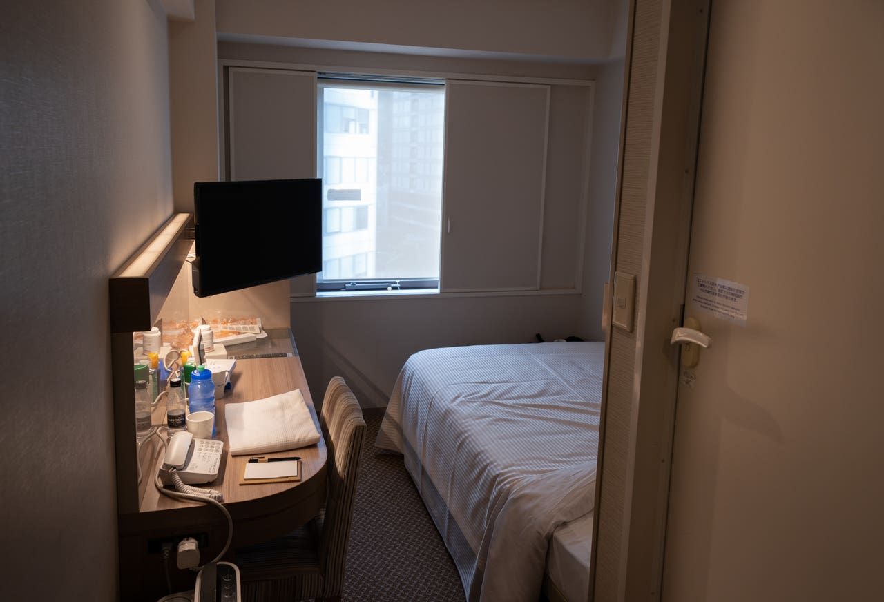 Hotel quarantine leaves visiting media straining on their Tokyo