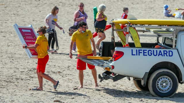Lifeguards on Crosby beach put out warning signs (Peter Byrne/PA)