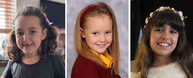 Left to right, six-year-old Bebe King, seven-year-old Elsie Dot Stancombe and Alice Dasilva Aguiar, nine 