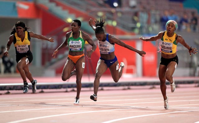 Shelly-Ann Fraser-Pryce, right, beats Dina Asher-Smith to 100m gold