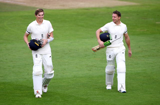 Zak Crawley (left) and Jos Buttler walk off at the end of play