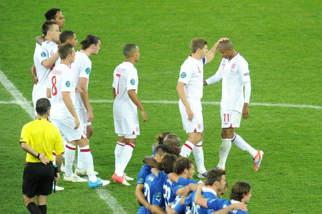Steven Gerrard consoles Ashley Young after missing his penalty 