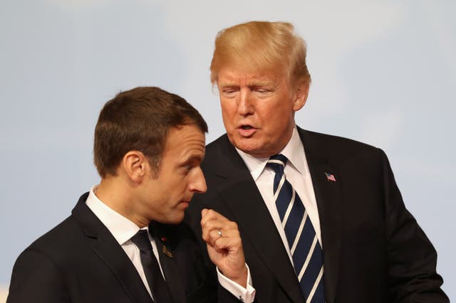 US President Donald Trump speaks to French President Emmanuel Macron (Matt Cardy/PA)
