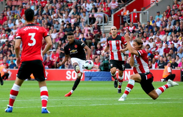 Jesse Lingard, centre, shoots wide