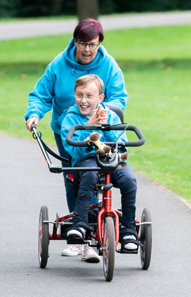 Inspirational young fundraiser Tobias Weller with his mother Ruth Garbutt (Danny Lawson/PA)