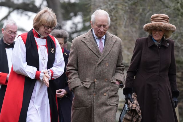 Dame Sarah Mullally, left, walking alongside the King, centre, and Camilla