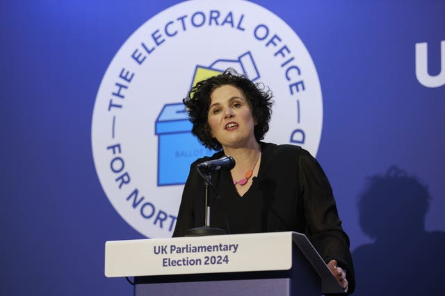 Claire Hanna speaking from a lectern reading 'UK parliamentary election 2024'