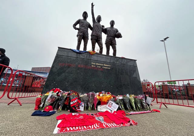 Tributes outside Old Trafford, home of Manchester United, in memory of Denis Law, following his death at the age of 84